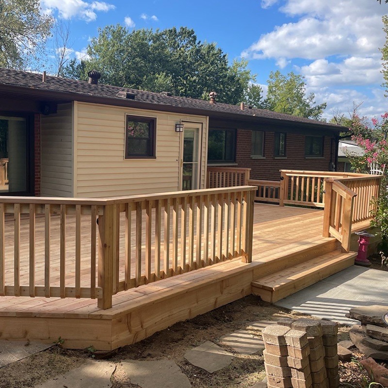 Large wood deck with steps and railing