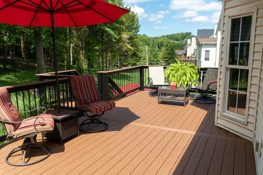 Composite deck and aluminum fence