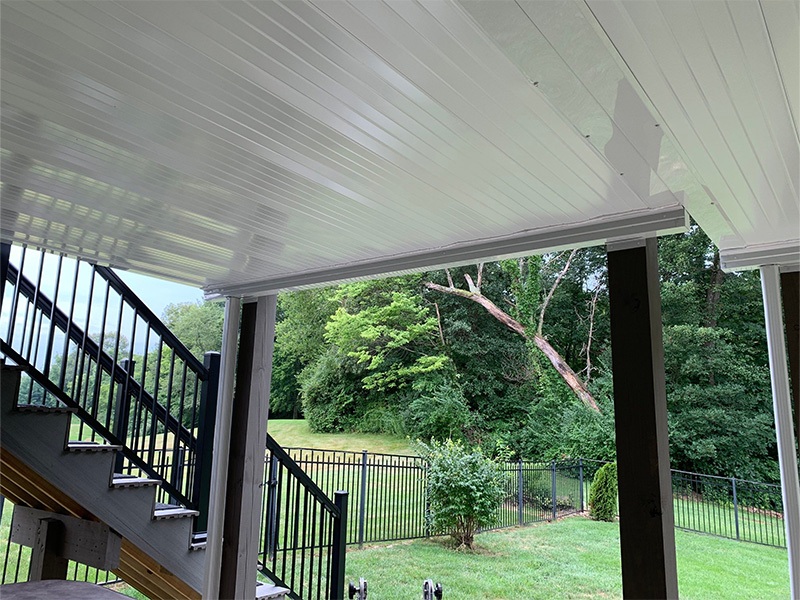 Underdeck system in lush backyard