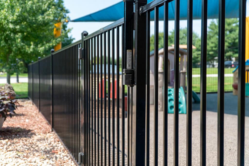 Aluminum fence and gate around playground