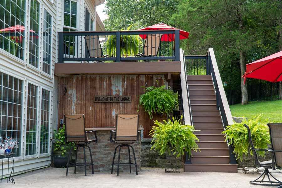 Composite deck and aluminum fence