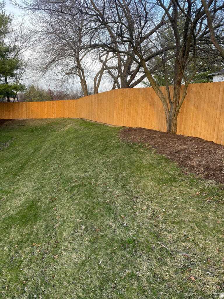 Steel enforced wood fence