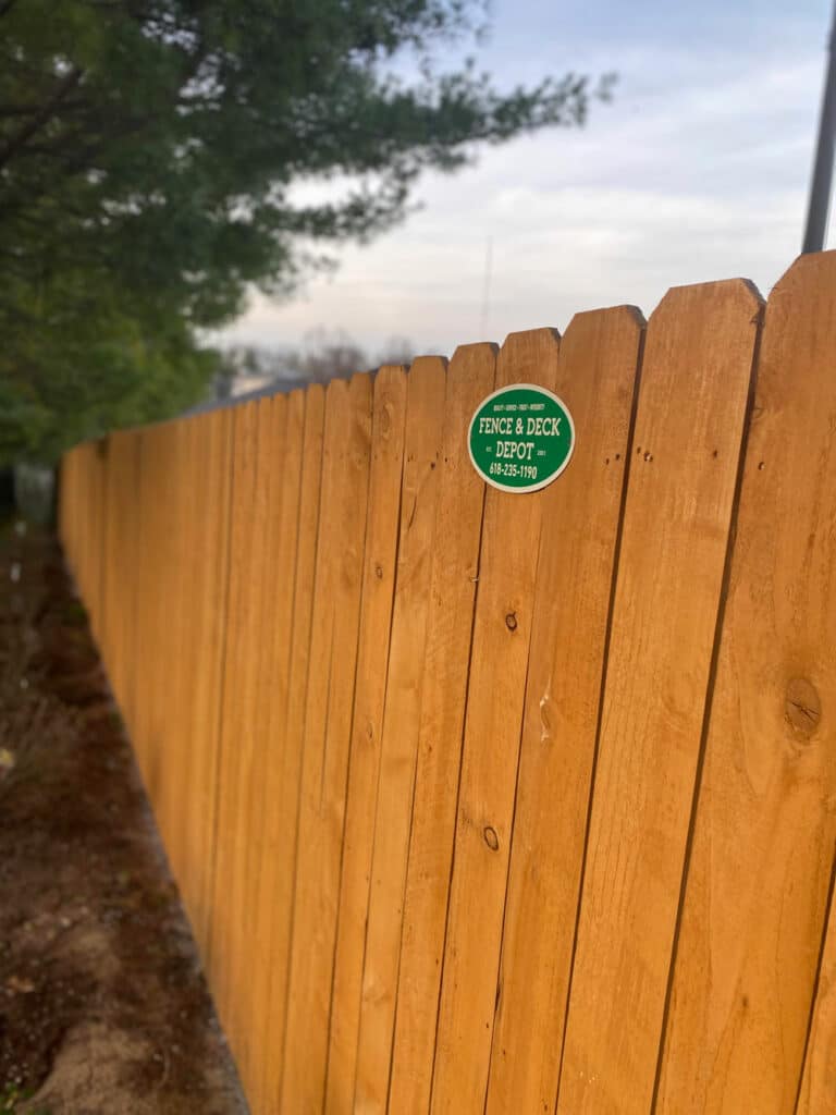Steel enforced wood fence