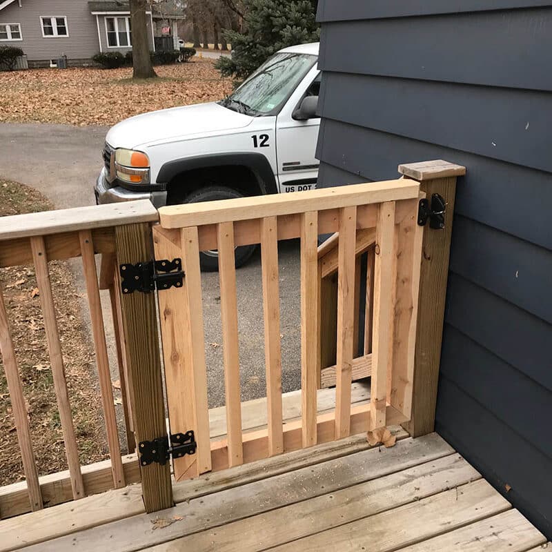 Wood deck with wooden railing and gate