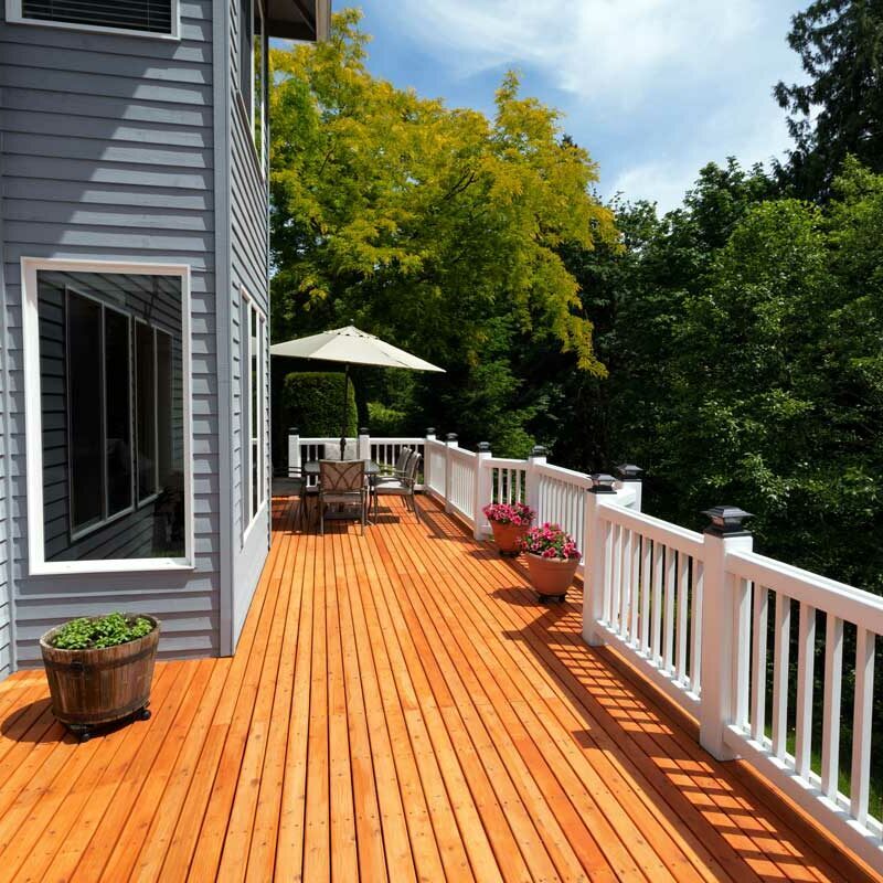 Large wood deck with white railing