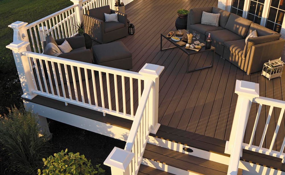 Luxury furnished deck with staircase and white railings