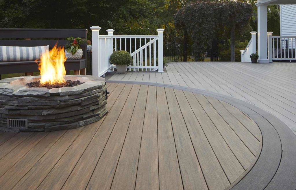 TimberTech deck with a circular pattern and fire pit in the center