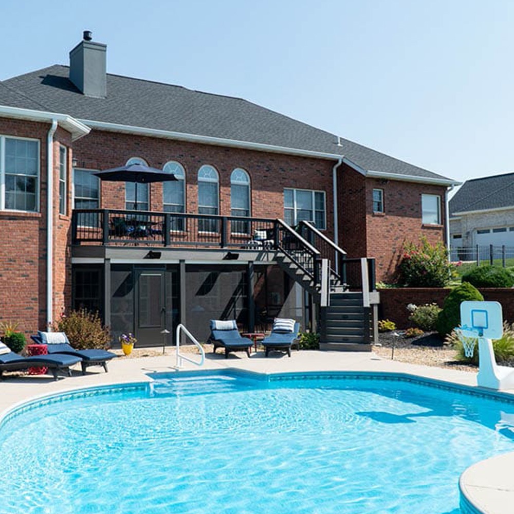 Tall deck overlooking large in-ground pool