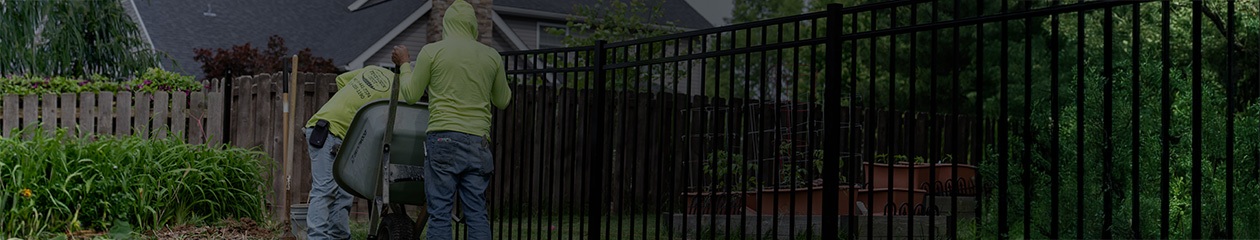 Fence and Deck Depot workers installing new fence