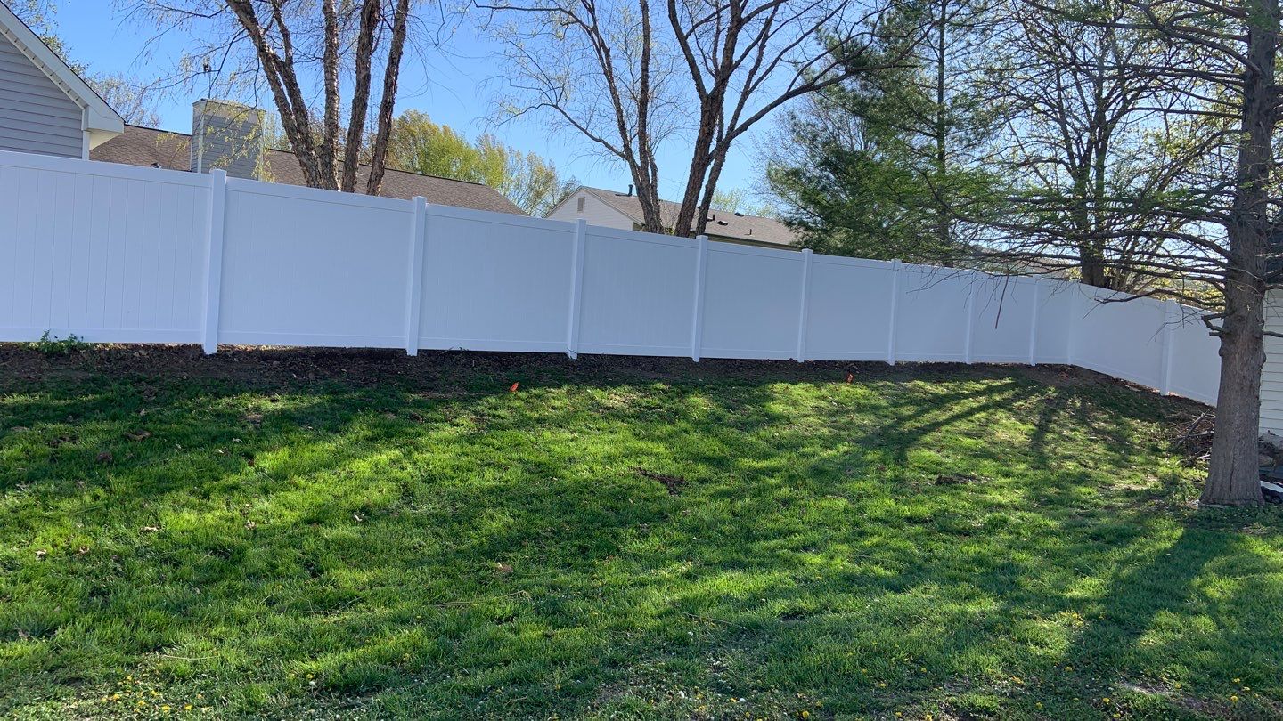 Large white vinyl privacy fence