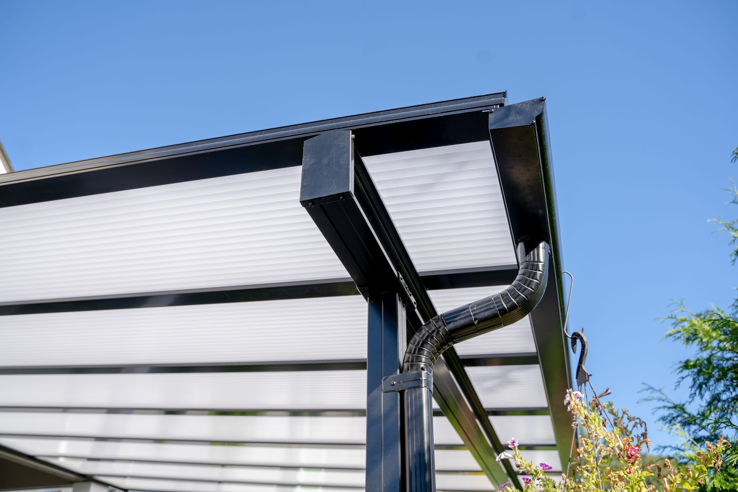 Fence & Deck Depot Traditional Patio Cover in Black Close Up Gutter