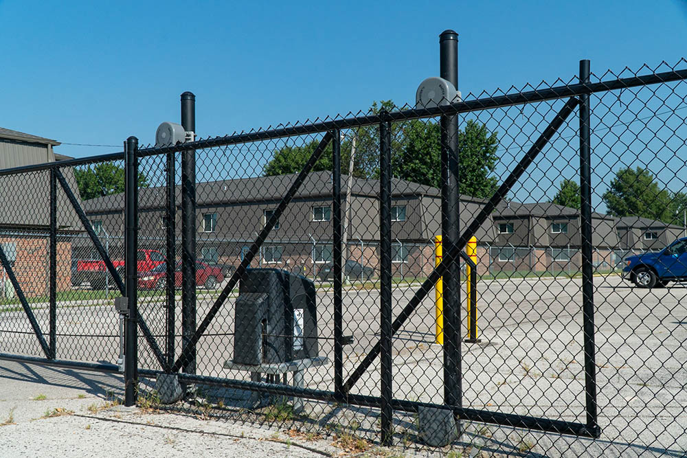 Chain link fence and gate around storage facility