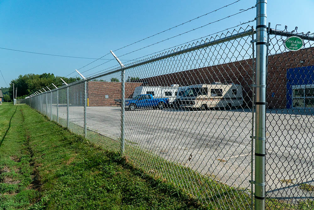 Chain link fence and gate around storage facility