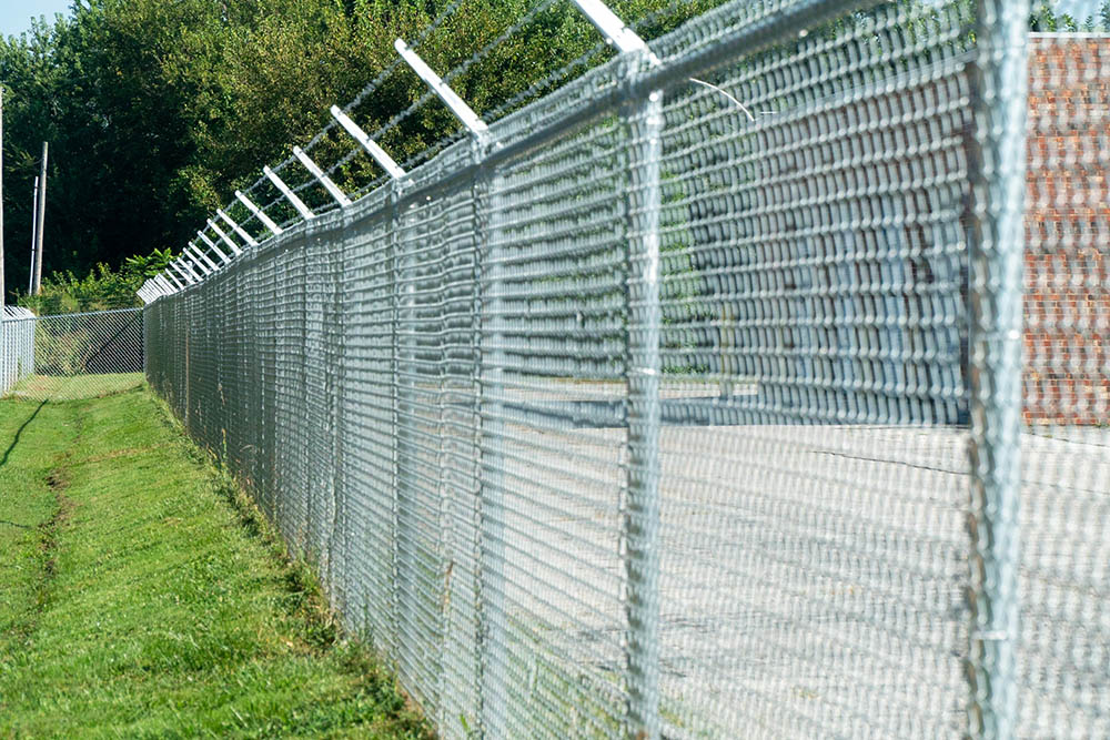 Chain link fence and gate around storage facility