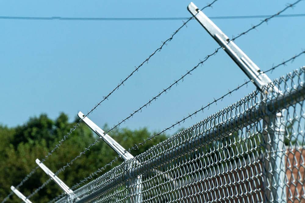 Chain link fence and gate around storage facility