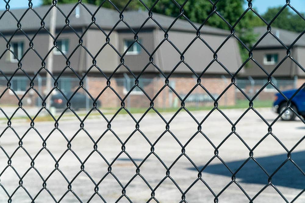 Chain link fence and gate around storage facility
