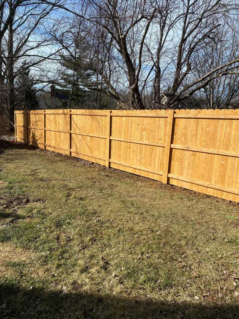 Steel enforced wood fence